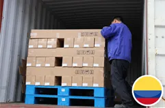 Worker arranging silicone boxes inside container to Colombia