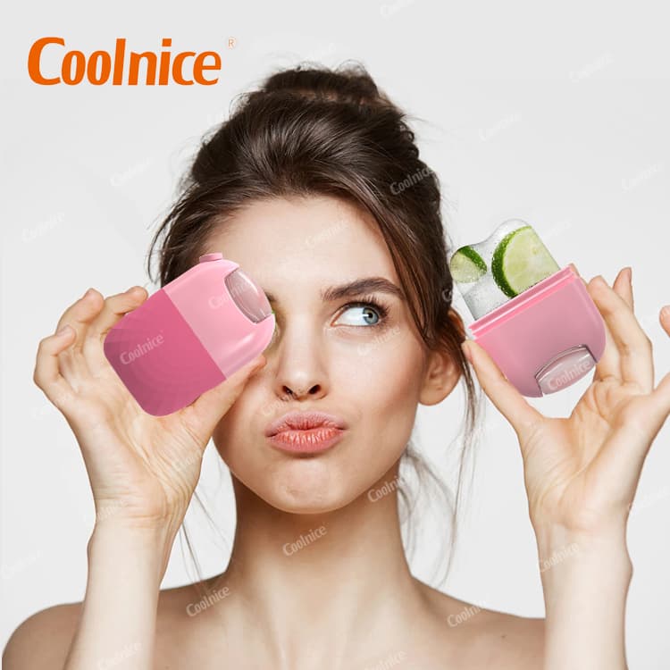 Woman holding pink silicone ice roller for facial skincare