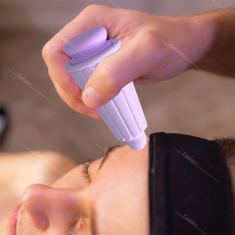 Using Purple Ice Cup on Forehead During Cold Facial Treatment