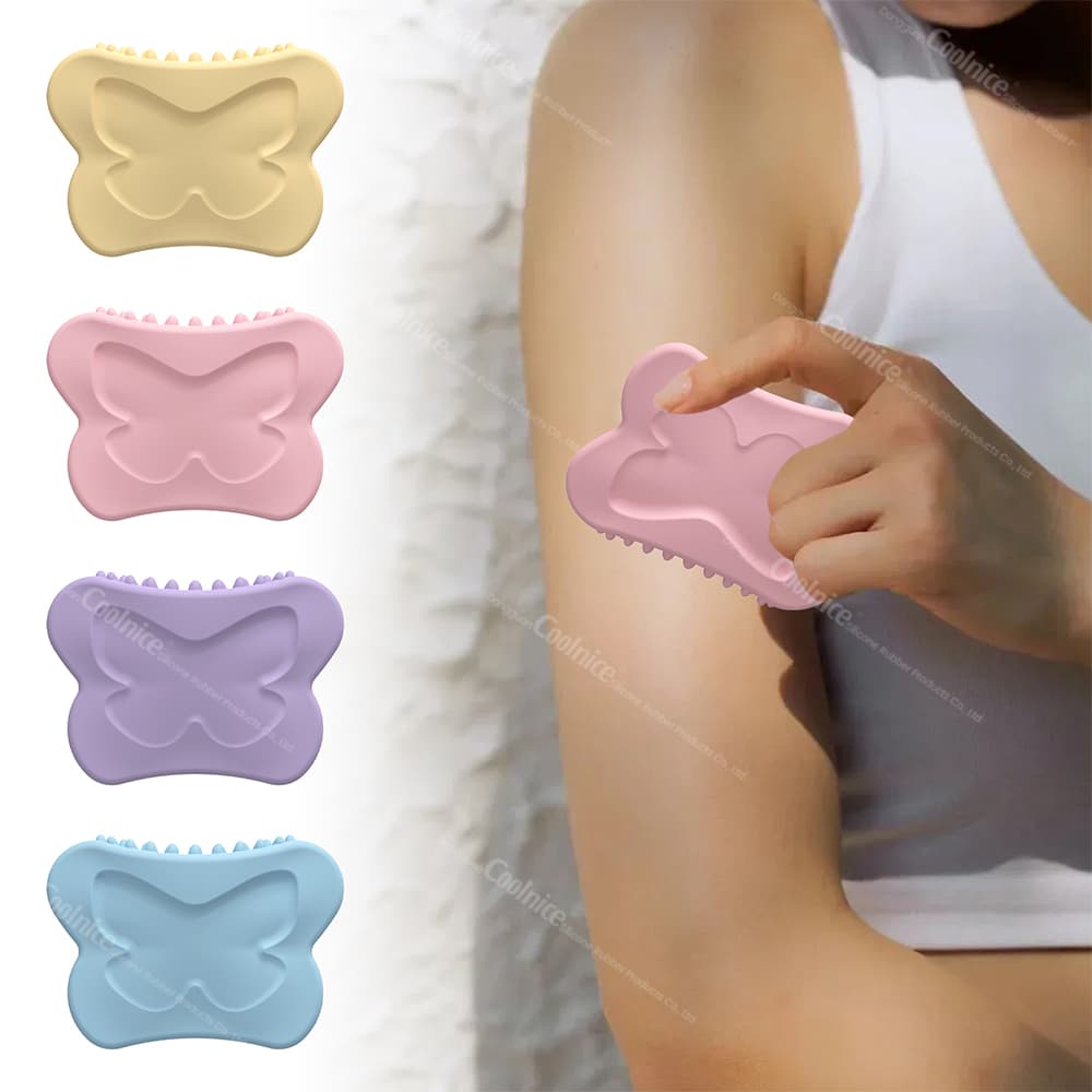 Silicone Gua Sha massager in butterfly shape, available in yellow, pink, purple, and blue colors. A person is using the pink massager on their arm, highlighting the ergonomic design and gentle, soothing massage.