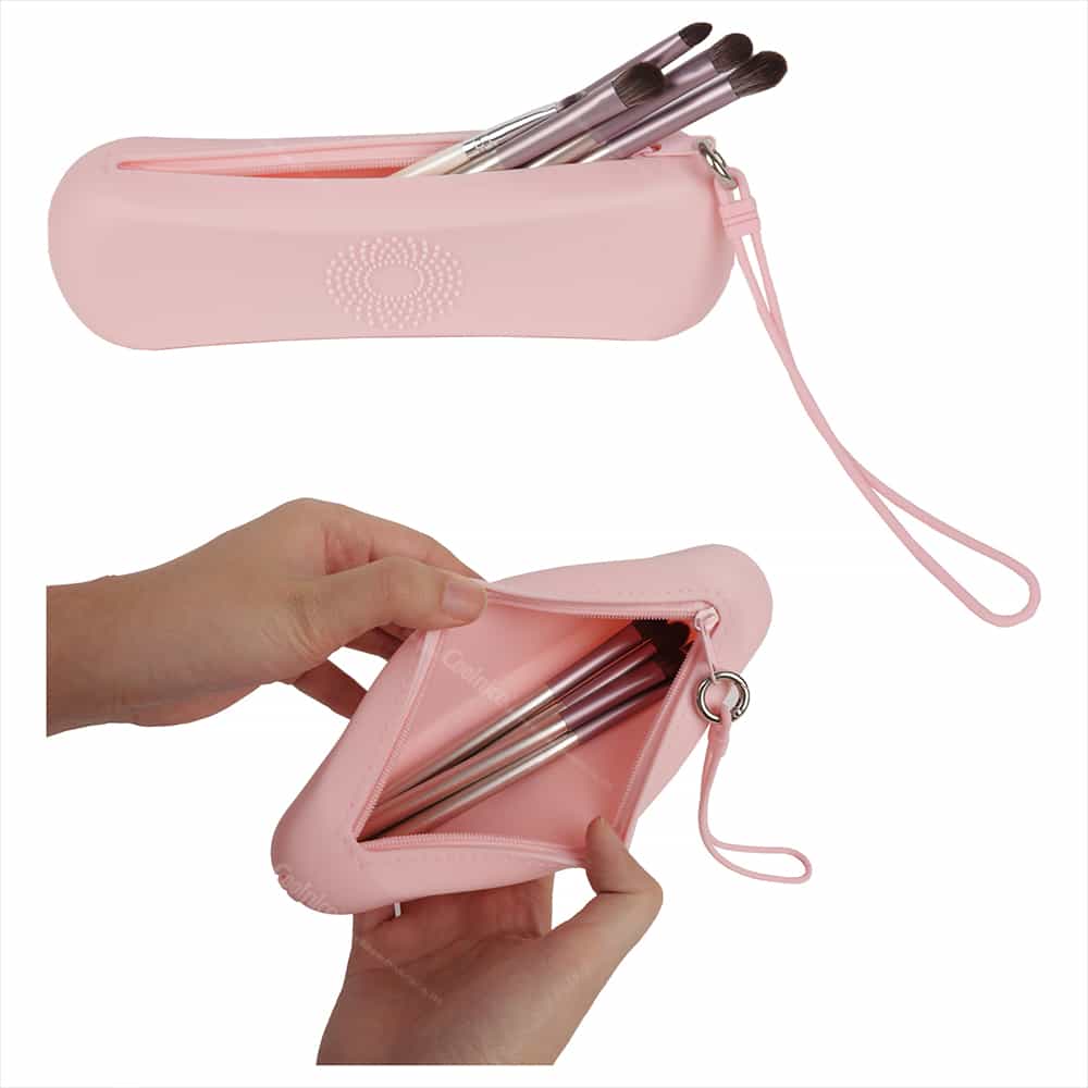 Pink silicone makeup brush pouch with zipper and brushes inside