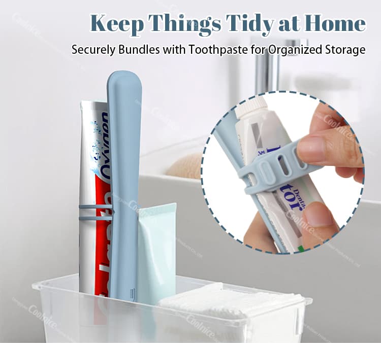 Blue silicone toothbrush holder securing a toothpaste tube for organized storage, shown in a bathroom setting with other toiletries.