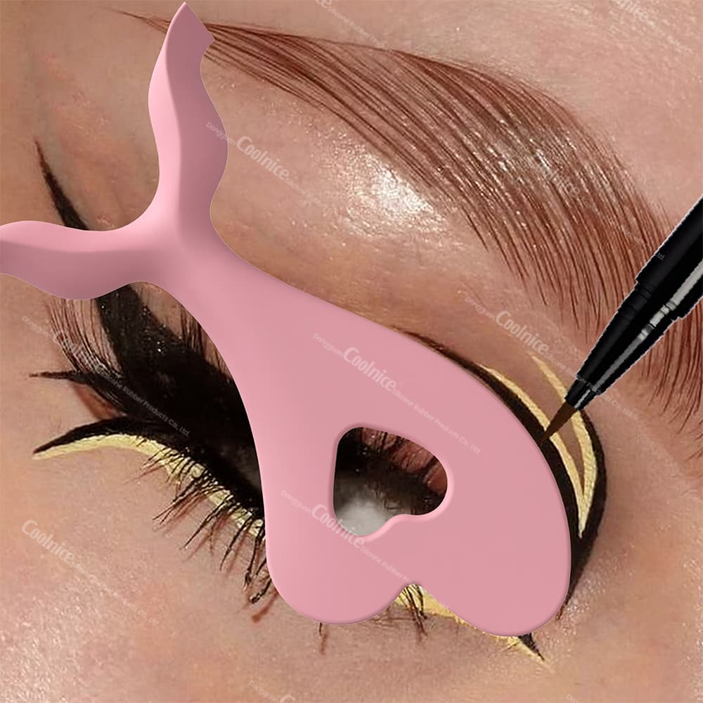 Pink eyeliner stencil tool used to create precise double-wing eye makeup.
