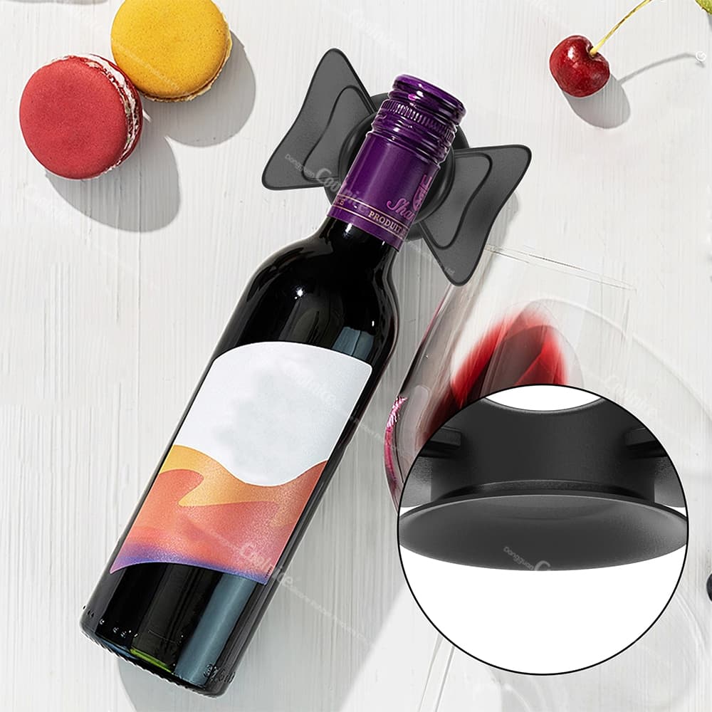 Black silicone bottle holder with wine storage on table