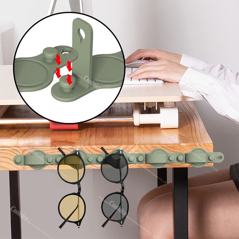 Close-up of the wall-mounted silicone glasses holder with a secure locking mechanism, showcasing two pairs of glasses.