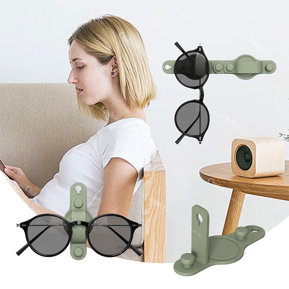 Wall-mounted silicone glasses holder with two pairs of sunglasses, showing user-friendly design for easy access.