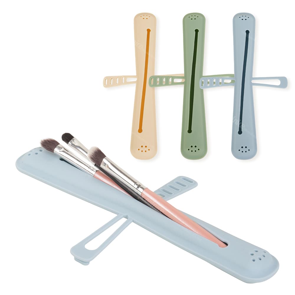 Colorful silicone holders in orange, green, and blue, designed to store makeup brushes or toothbrushes, with a blue holder shown with brushes inside.
