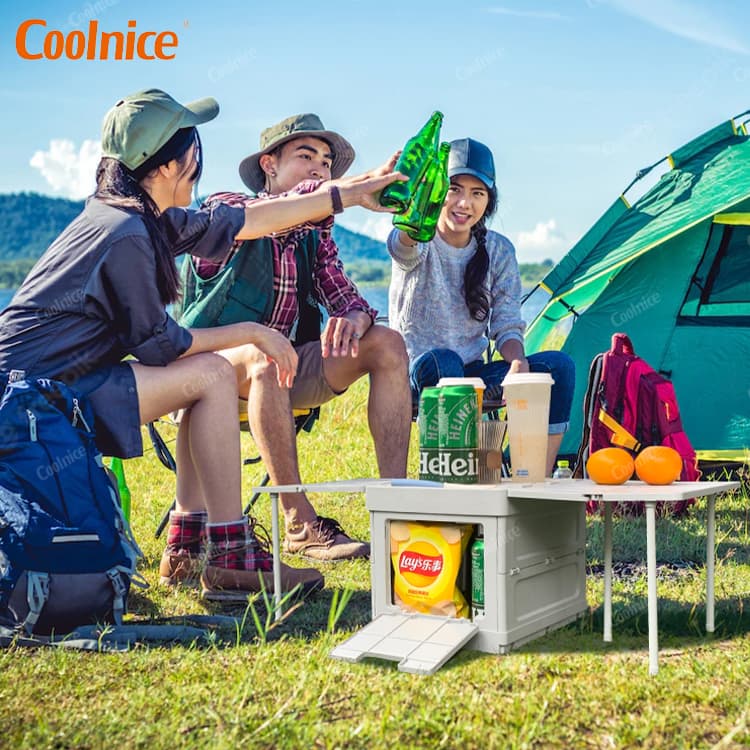 Outdoor camping box used as a table and storage for drinks and snacks.