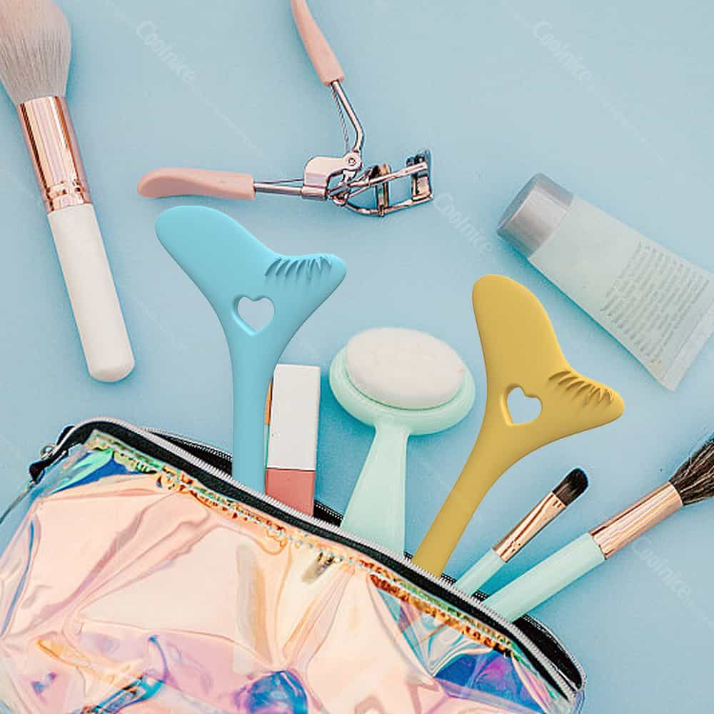 Silicone eyeliner tools in makeup bag with cosmetic accessories.