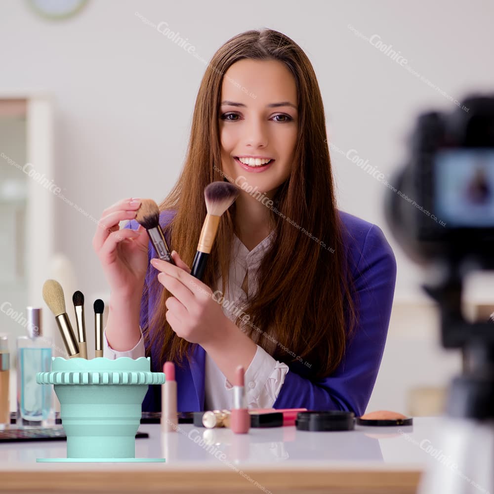 Vlogger showing silicone makeup brush holder cup