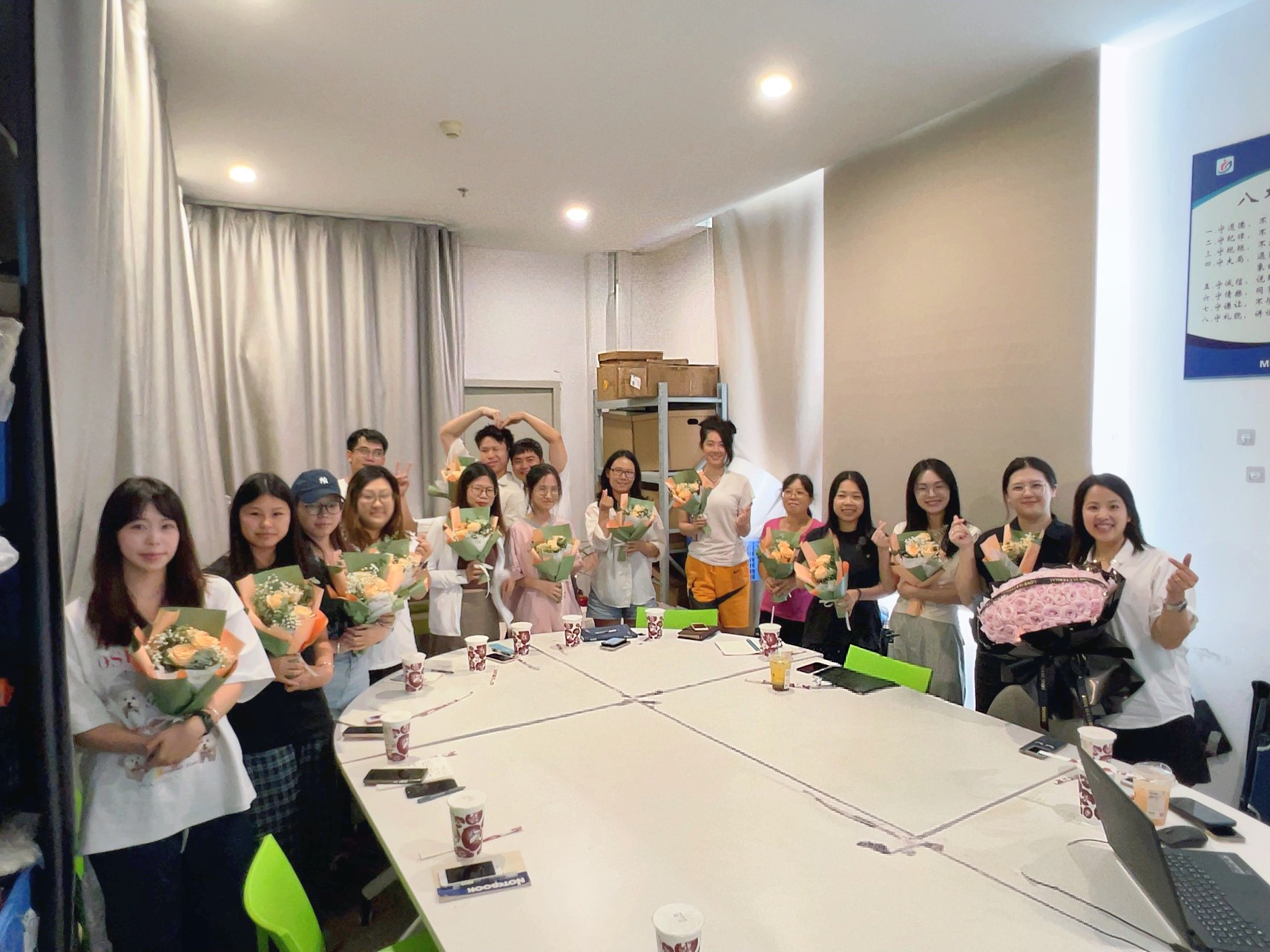 Coolnice team members in the office celebrating Qixi Festival, showcasing teamwork and office culture.