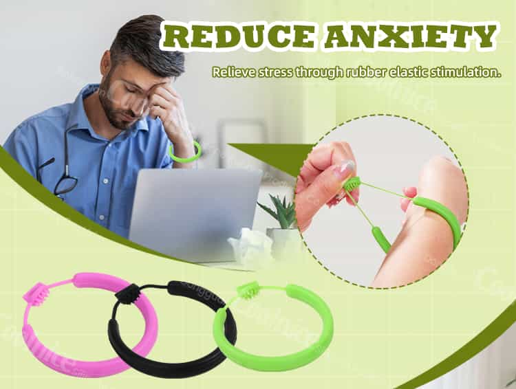 Man wearing green silicone stress relief bracelet at office desk.