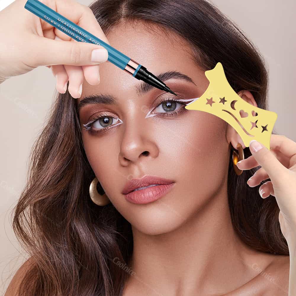 Woman applying eyeliner with yellow moon and star stencil.