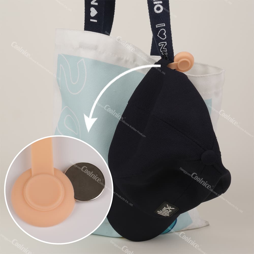 Silicone magnetic clip holding hat on a tote bag