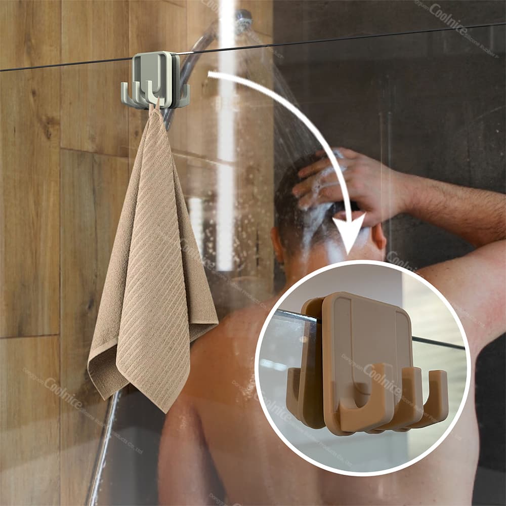 Silicone shower glass door hook holding towel in bathroom