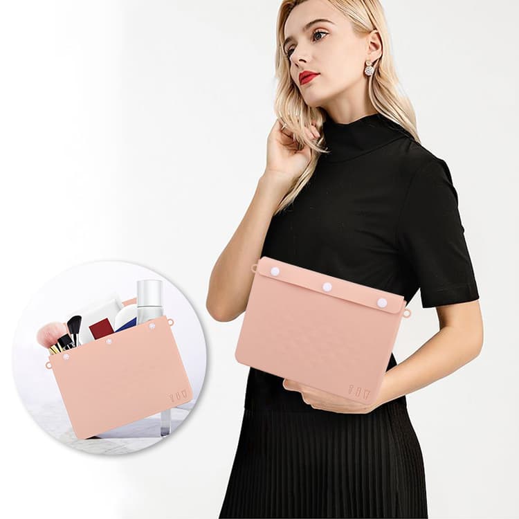Silicone bag for makeup storage carried by woman