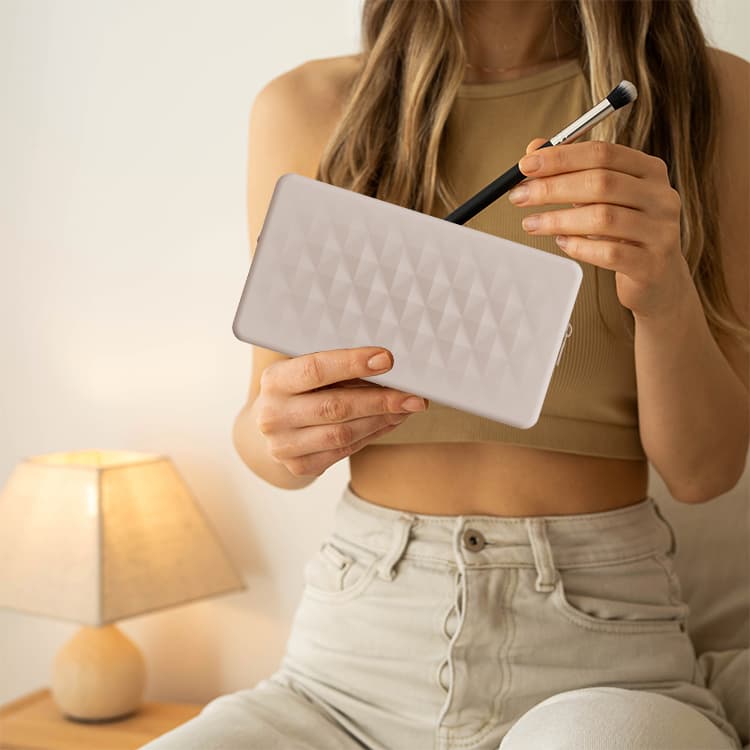 Silicone makeup bag held in hand for daily beauty storage