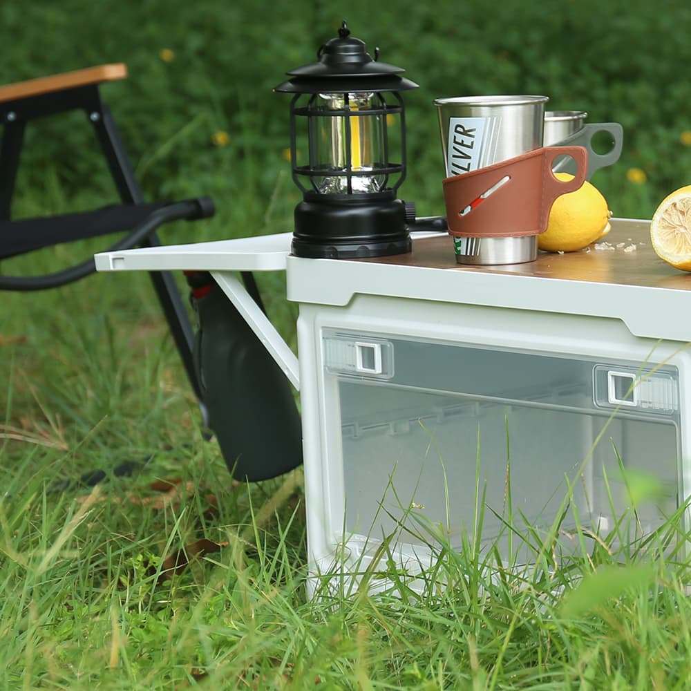 Close-up of pull-out side board on folding camping box