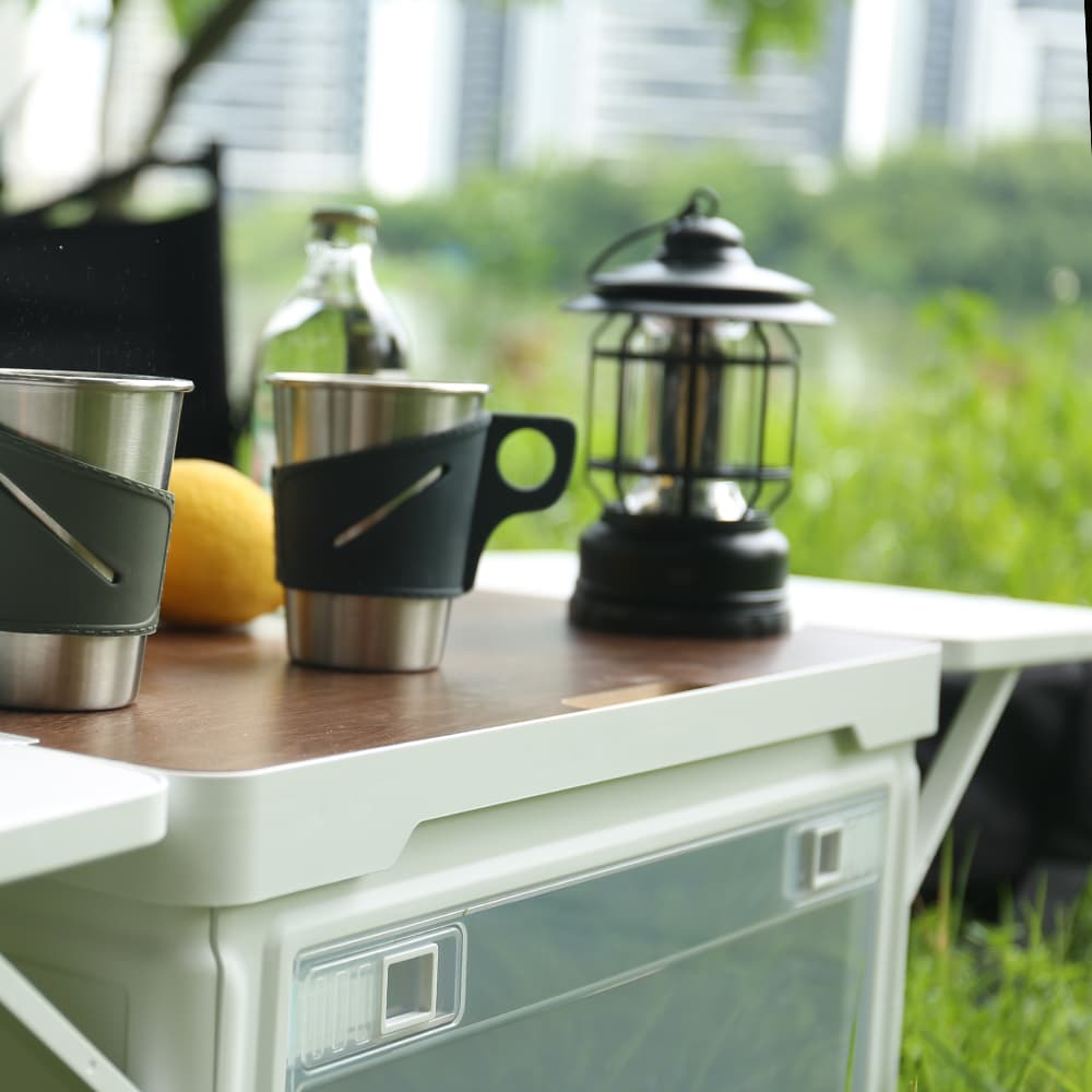 Person sitting on a sturdy foldable camping storage box