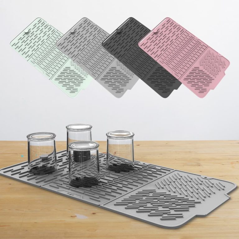 Silicone drying mat with glass cups on wooden table