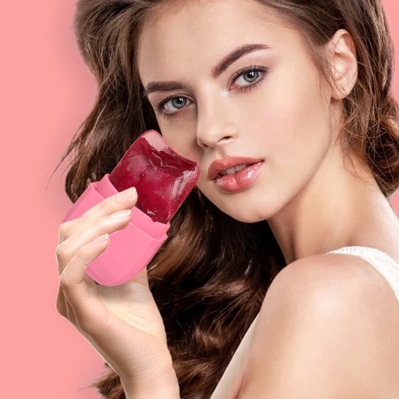 Model applying pink facial ice cube roller on cheek