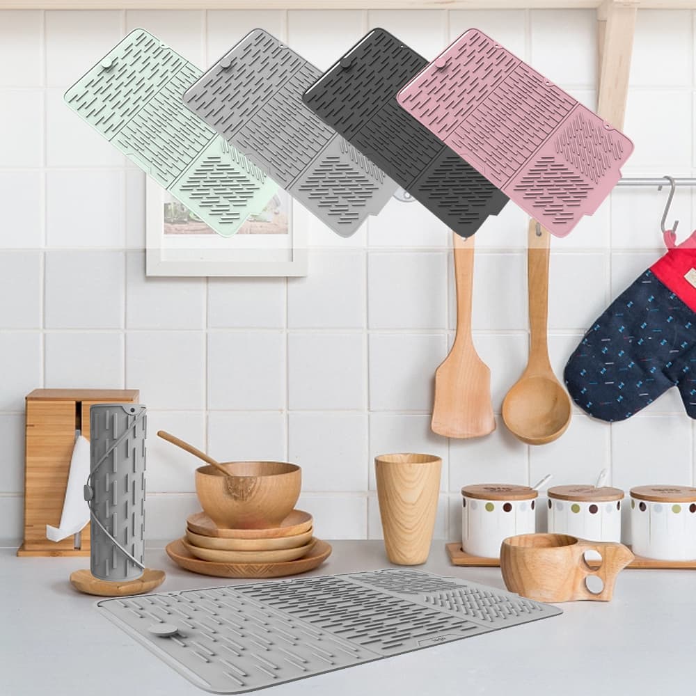 Foldable silicone drying mat hanging on kitchen wall