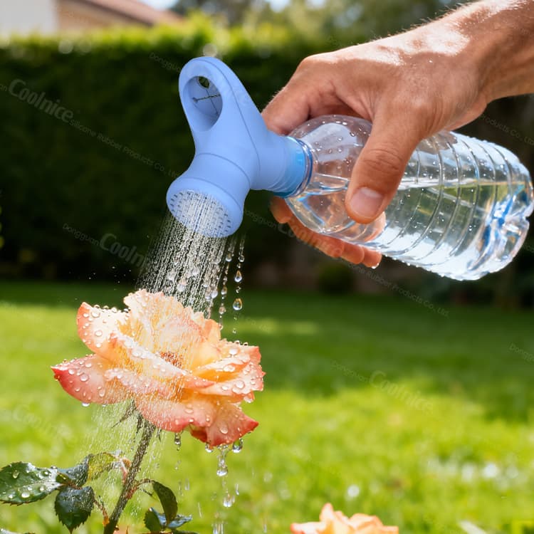 Hand watering plants using silicone bottle shower nozzle.