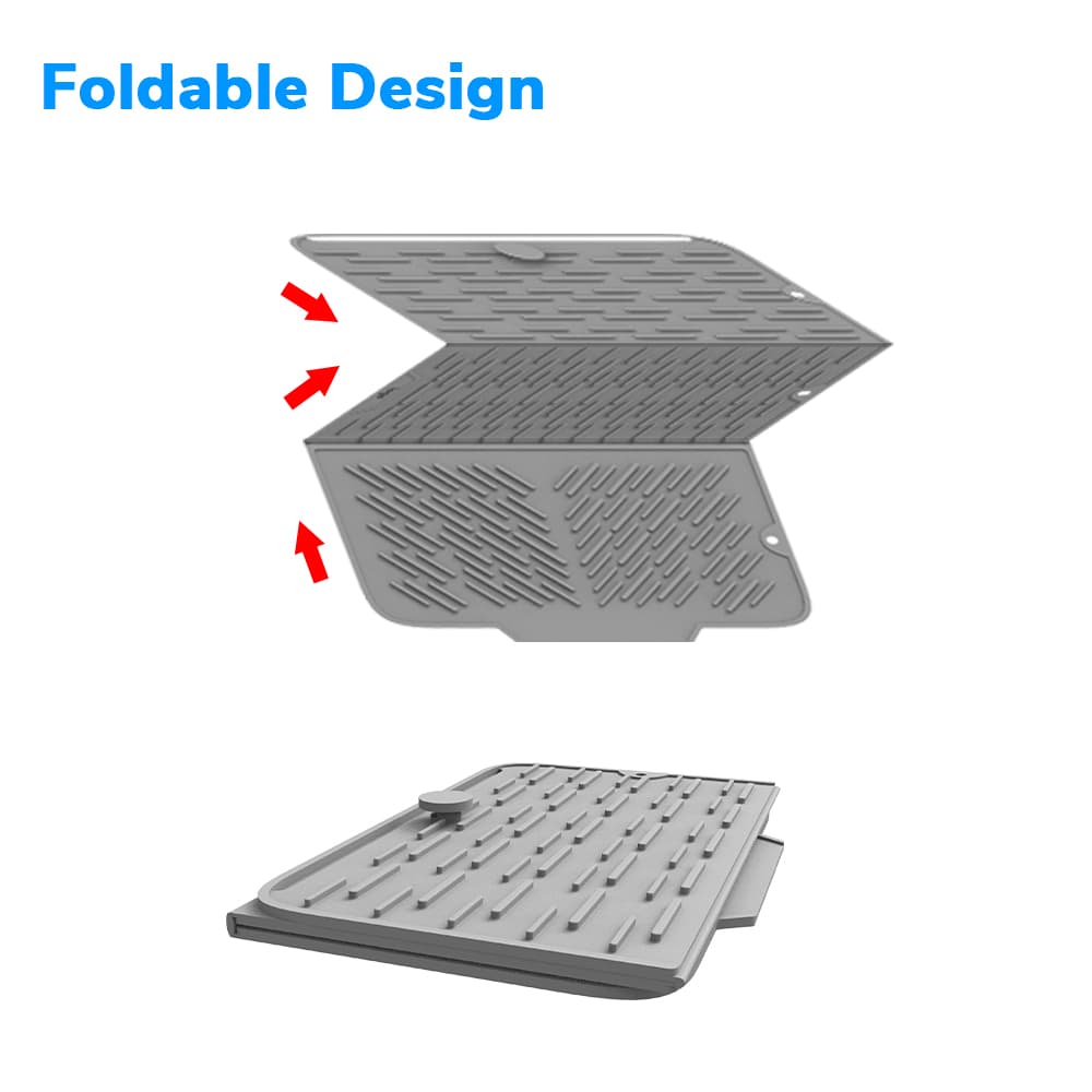 Silicone drying mat being washed under running water