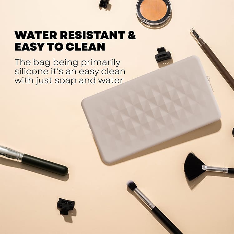 Water-resistant silicone makeup bag shown with beauty tools