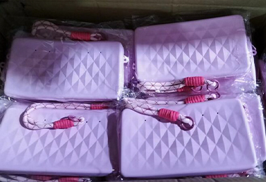Bulk packaged silicone storage pouches in purple, sealed and ready for shipment.