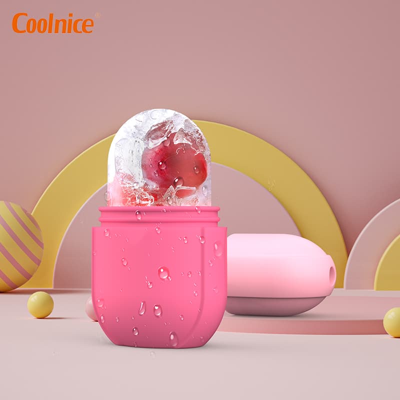 Pink facial ice cube roller with frozen fruit inside