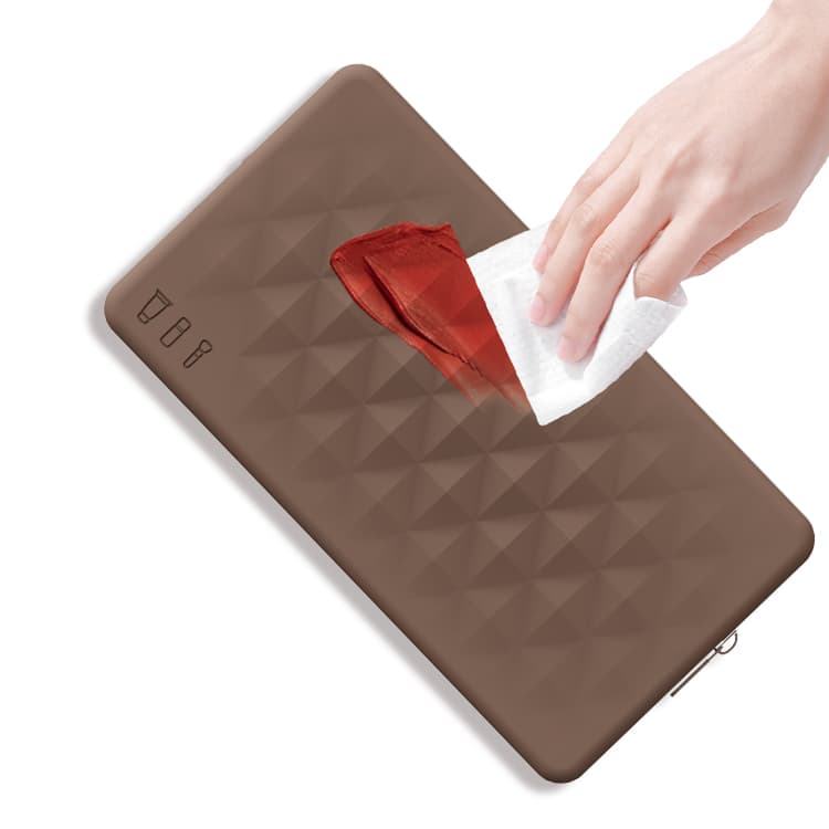 Silicone makeup bag being cleaned with a wipe