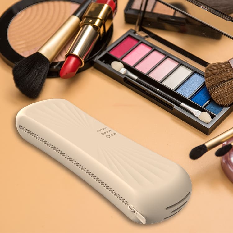 Silicone makeup brush bag on vanity table with cosmetics