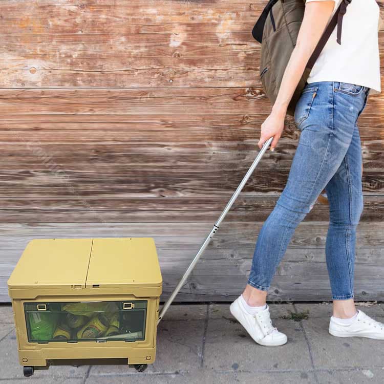 Portable camping storage box with telescopic pull handle for easy transport.