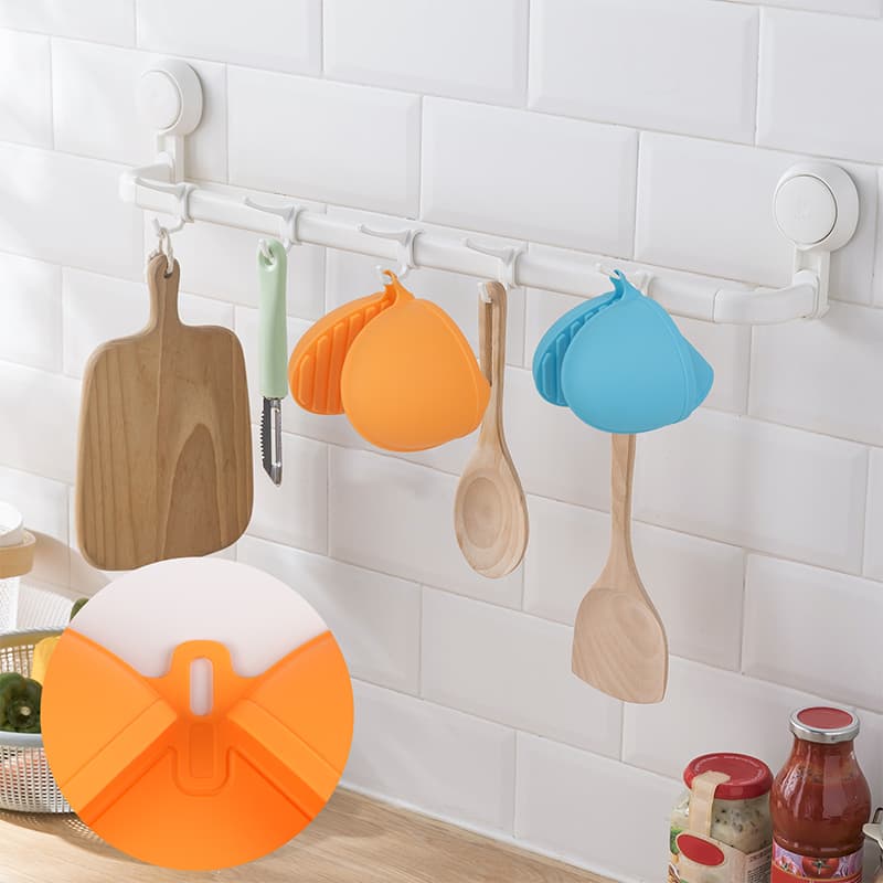Silicone pot holders protecting hands from hot cookware