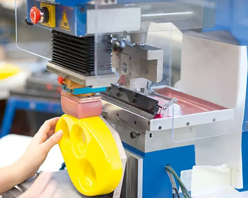 Silicone logo printing process in OEM manufacturing facility during mass production