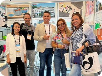 International buyers reviewing Coolnice product materials at the booth