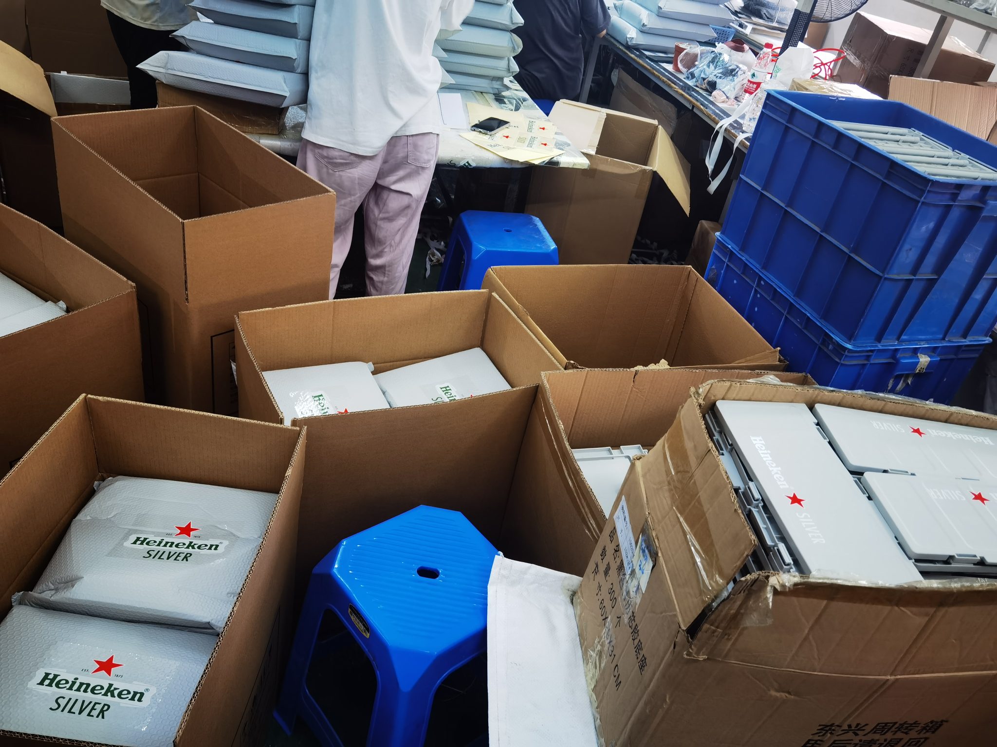 Custom storage box components being assembled and packed in the factory